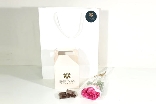 pink single rose with chocolate