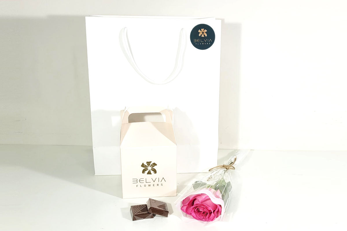 pink single rose with chocolate